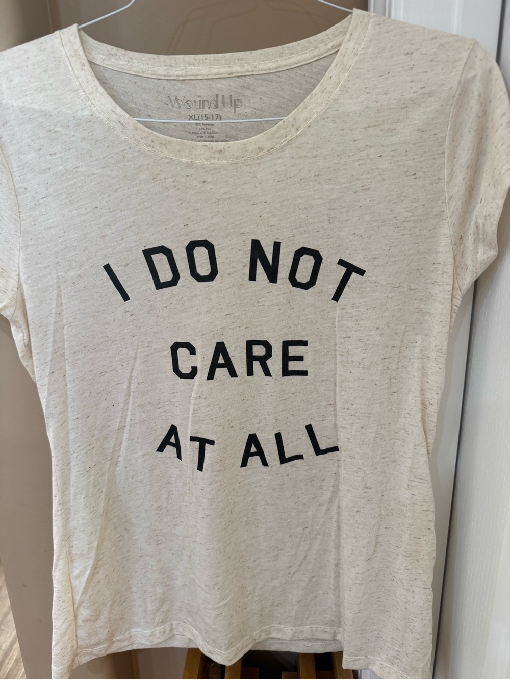 Wound Up Cream Graphic Tee with Black Text